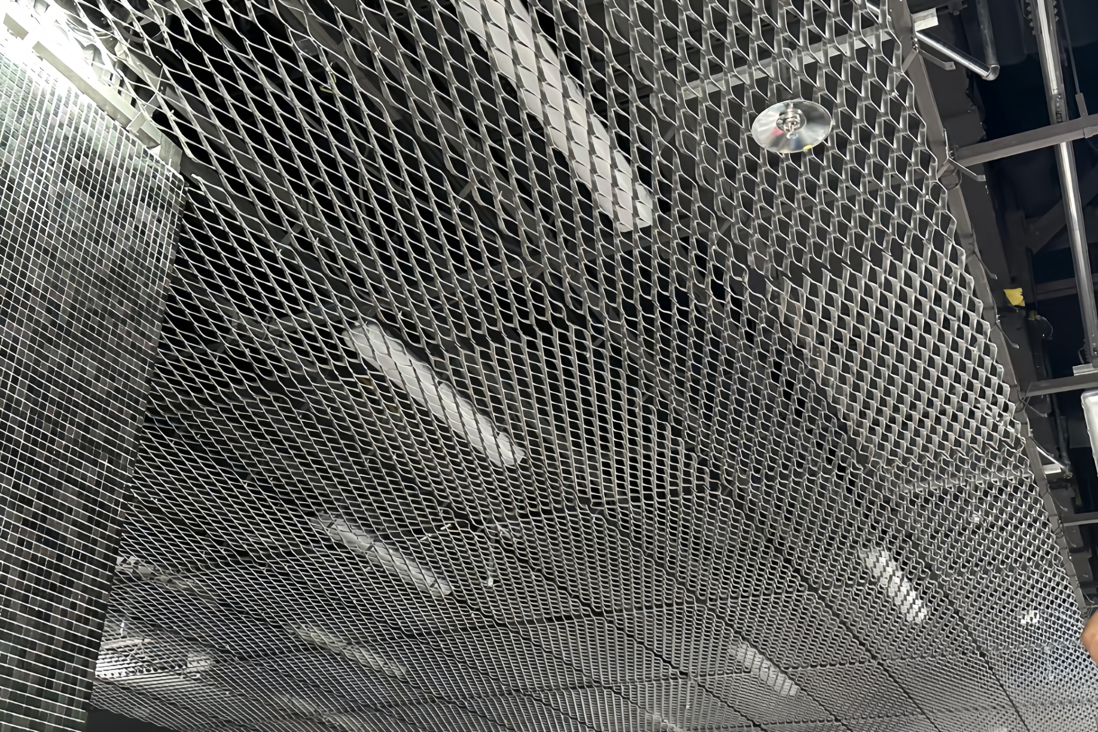 Expanded metal ceiling system metallic ceiling grid with reflective surface